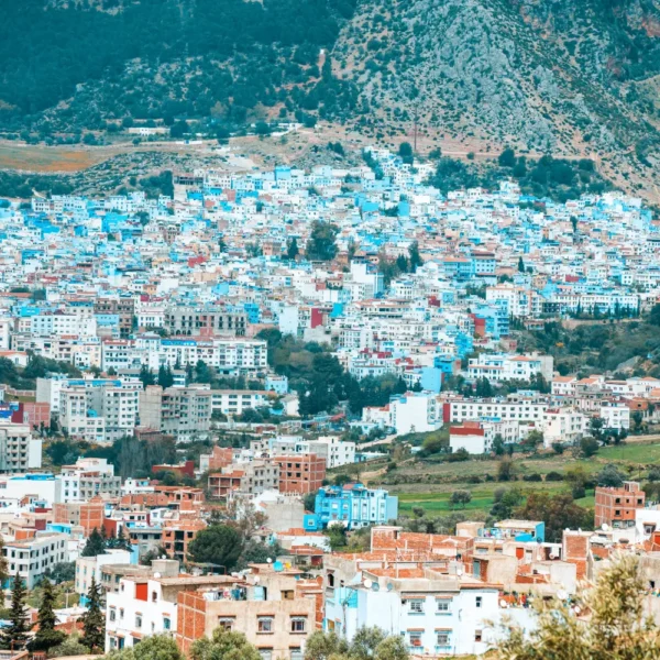 Panoramic view of Chefchaouen, its blue houses spread below the Rif mountains